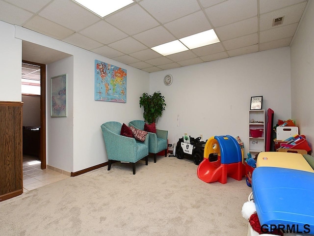 rec room featuring a paneled ceiling, visible vents, and carpet floors