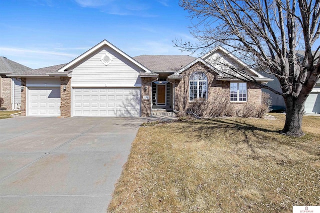 ranch-style house with brick siding, a shingled roof, a front lawn, concrete driveway, and an attached garage