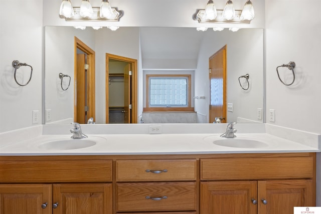 bathroom featuring double vanity and a sink