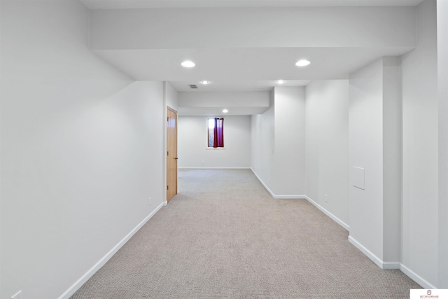 below grade area featuring carpet, recessed lighting, and baseboards