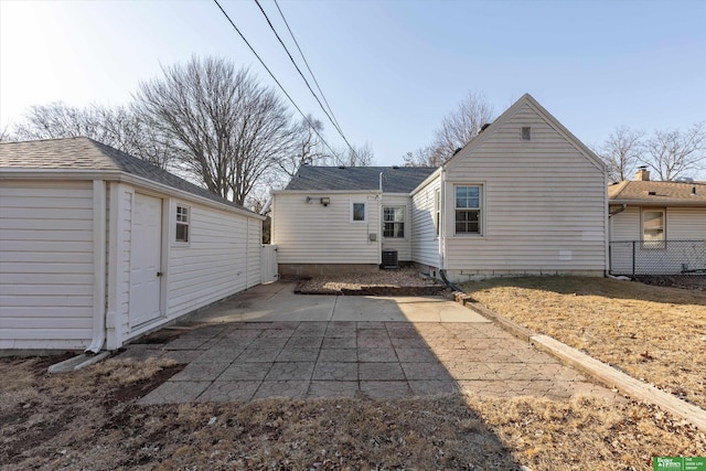 back of property with a patio