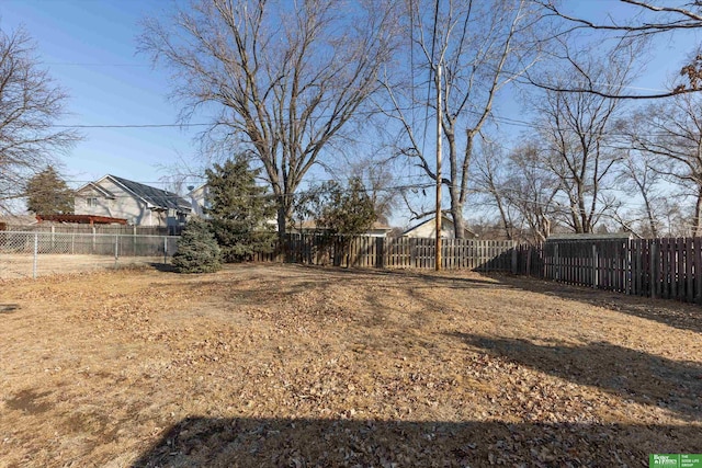 view of yard with a fenced backyard