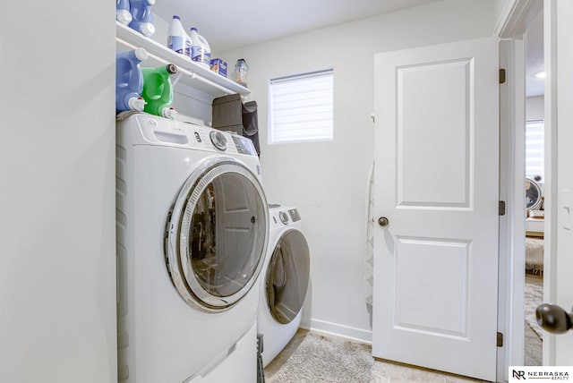 clothes washing area with laundry area and independent washer and dryer