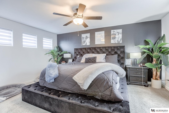 bedroom with baseboards, carpet floors, and ceiling fan