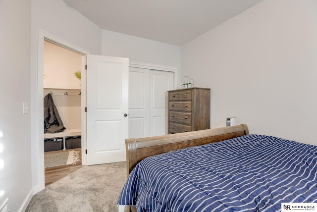 carpeted bedroom with a closet