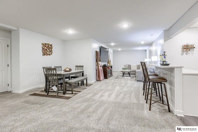 dining room with recessed lighting, baseboards, and carpet