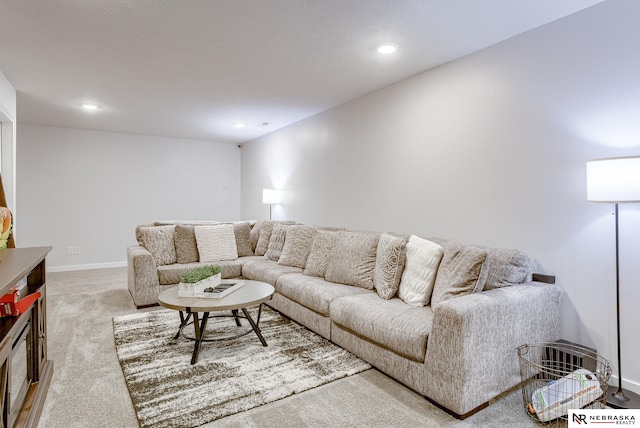 living room with recessed lighting, baseboards, and carpet flooring