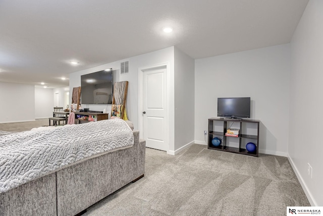 carpeted bedroom featuring recessed lighting, baseboards, and visible vents