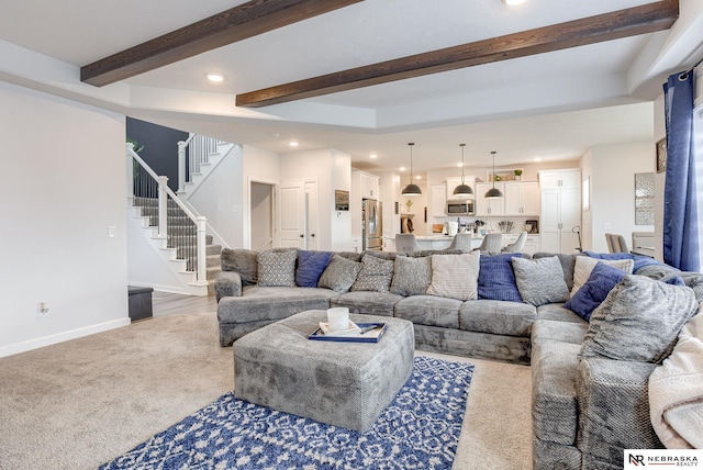 living room with stairway, baseboards, carpet floors, beam ceiling, and recessed lighting