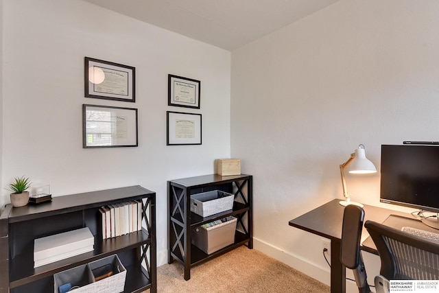 office space with baseboards and carpet