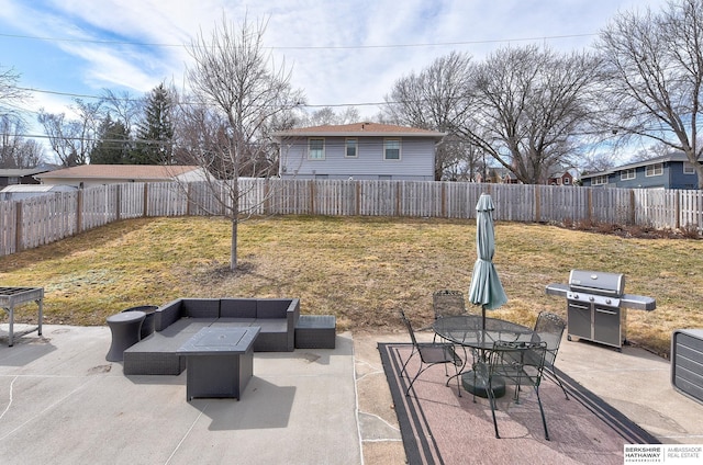 view of patio / terrace with grilling area, an outdoor hangout area, and a fenced backyard