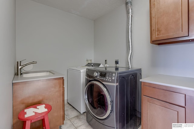21839 Hillandale Rd, Elkhorn, NE 68022 - laundry room with cabinet space, washing machine and dryer, and light tile patterned floors