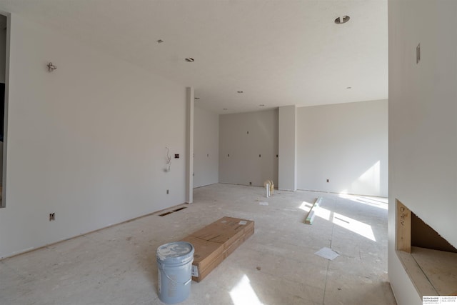 unfurnished room with visible vents