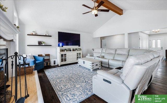 living room featuring lofted ceiling with beams, wood finished floors, ceiling fan, and a fireplace