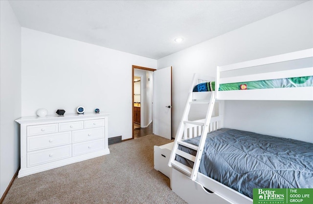 carpeted bedroom featuring baseboards