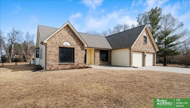 view of front of house featuring brick siding, concrete driveway, an attached garage, and a shingled roof