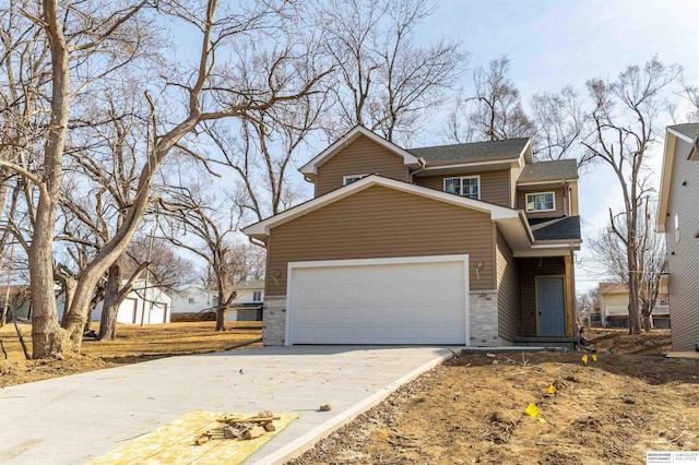 traditional home with an attached garage and driveway