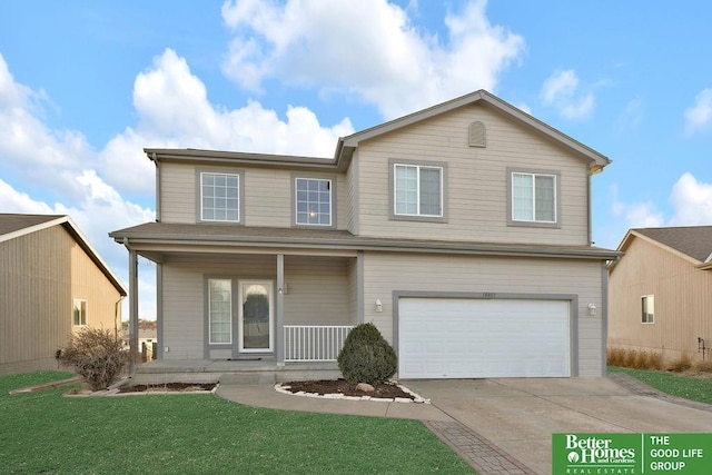 traditional home with a porch, a front lawn, driveway, and a garage