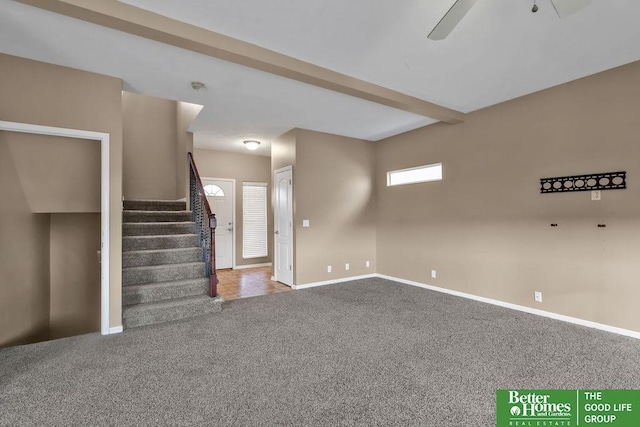 interior space with beamed ceiling, a ceiling fan, carpet, baseboards, and stairs