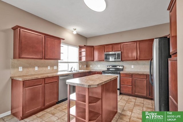 kitchen with tasteful backsplash, appliances with stainless steel finishes, open shelves, and a sink