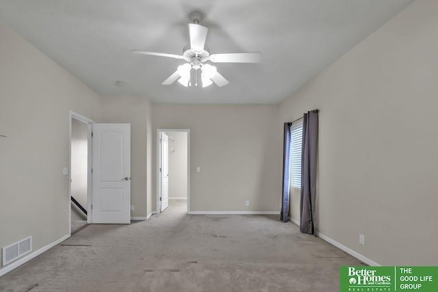 empty room featuring visible vents, baseboards, ceiling fan, and carpet flooring