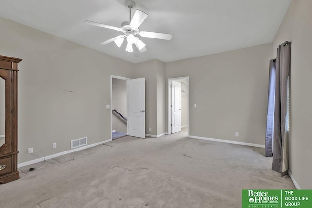 unfurnished bedroom with visible vents, ceiling fan, baseboards, and carpet floors