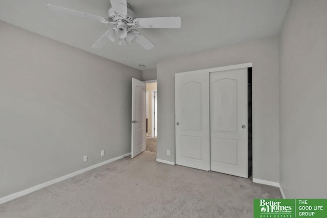 unfurnished bedroom with a closet, ceiling fan, carpet, and baseboards