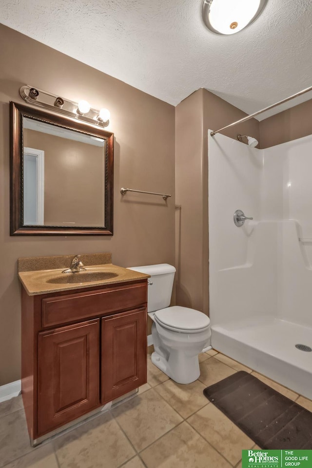 full bath with vanity, toilet, walk in shower, and a textured ceiling