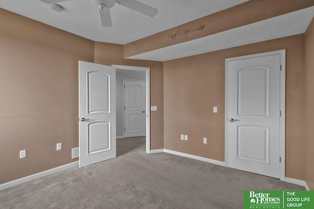 unfurnished bedroom with a ceiling fan, visible vents, baseboards, and carpet floors