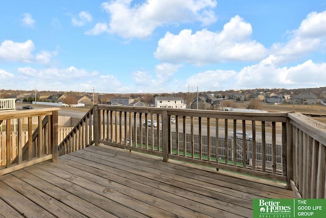 wooden deck featuring a residential view