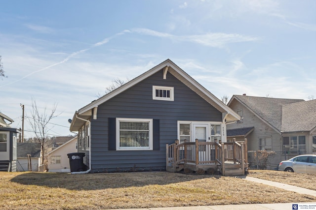 bungalow-style house with a front yard