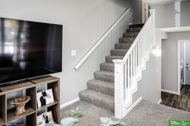 stairway featuring wood finished floors and baseboards