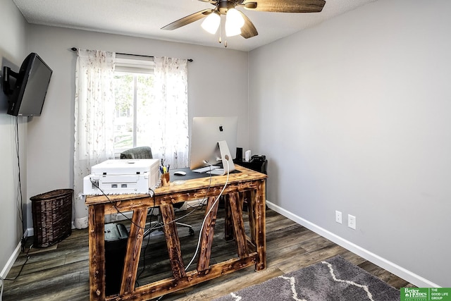 home office with wood finished floors, a ceiling fan, and baseboards