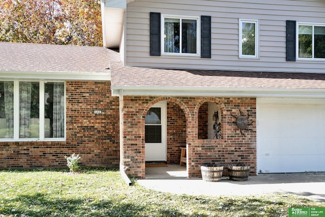 property entrance with brick siding and a shingled roof