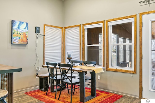 dining area with wood finished floors