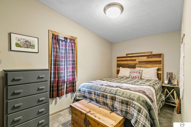 carpeted bedroom featuring a textured ceiling