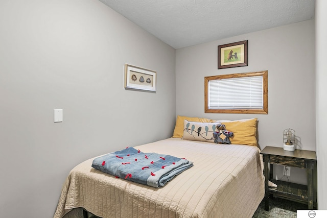 bedroom featuring a textured ceiling