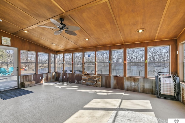 unfurnished sunroom with wooden ceiling, lofted ceiling, and ceiling fan