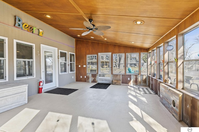 sunroom / solarium featuring wooden ceiling, ceiling fan, and vaulted ceiling