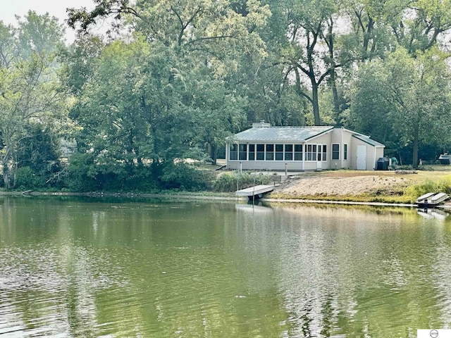 property view of water featuring a forest view