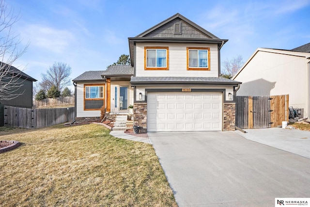 view of front of house featuring a front lawn, a gate, driveway, fence, and a garage