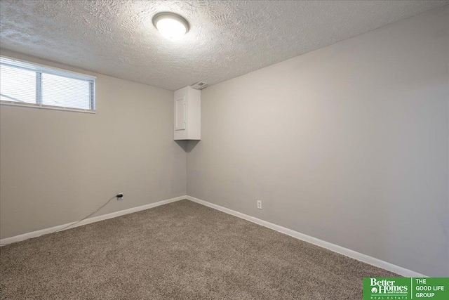 interior space with visible vents, baseboards, a textured ceiling, and carpet flooring