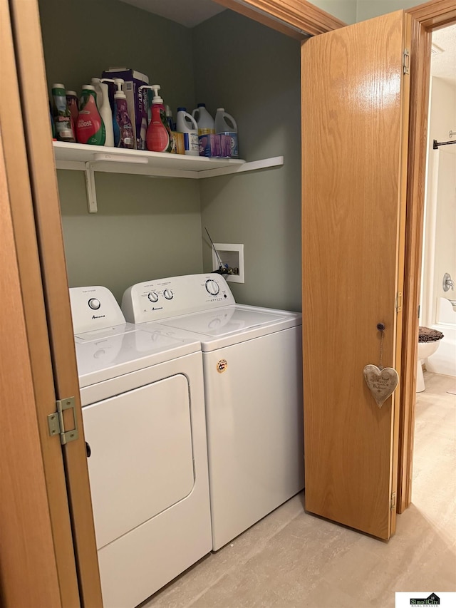 laundry room featuring laundry area and washer and clothes dryer