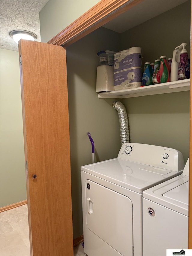 clothes washing area with washer and dryer and laundry area