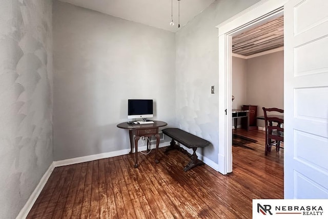 interior space with wood finished floors and baseboards