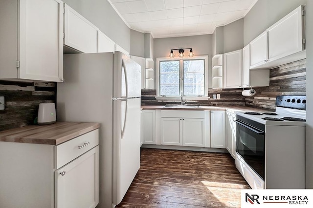 kitchen with open shelves, a sink, range with electric stovetop, white cabinets, and decorative backsplash