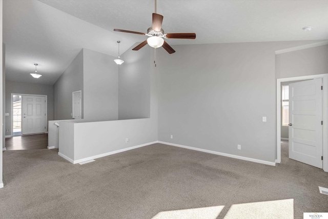 interior space with vaulted ceiling, baseboards, a wealth of natural light, and ceiling fan