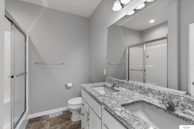 bathroom featuring a sink, baseboards, and a shower stall