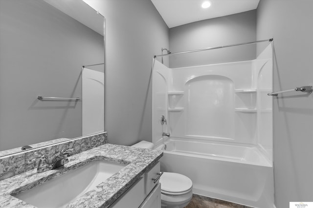 bathroom with shower / bathtub combination, toilet, and vanity