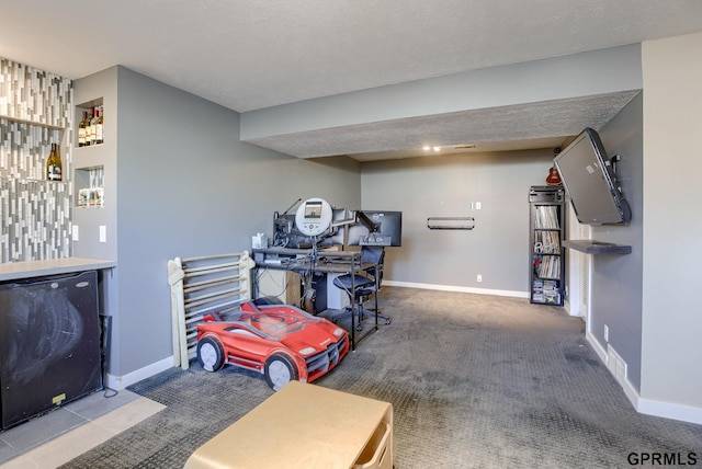 interior space with carpet, baseboards, and a textured ceiling